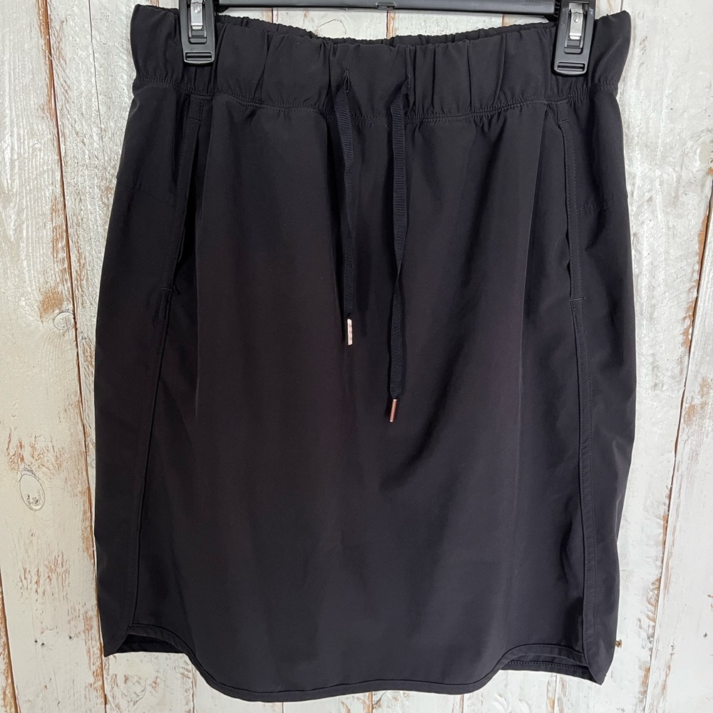 Calia by Carrie Underwood black casual tulip hem skirt